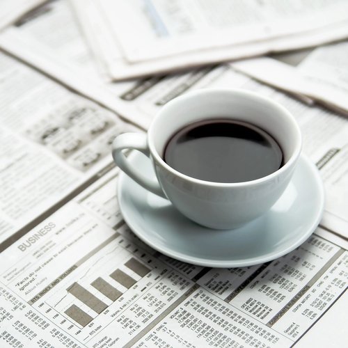 A cup of coffee in the newspaper from Floor House in Powers Lake